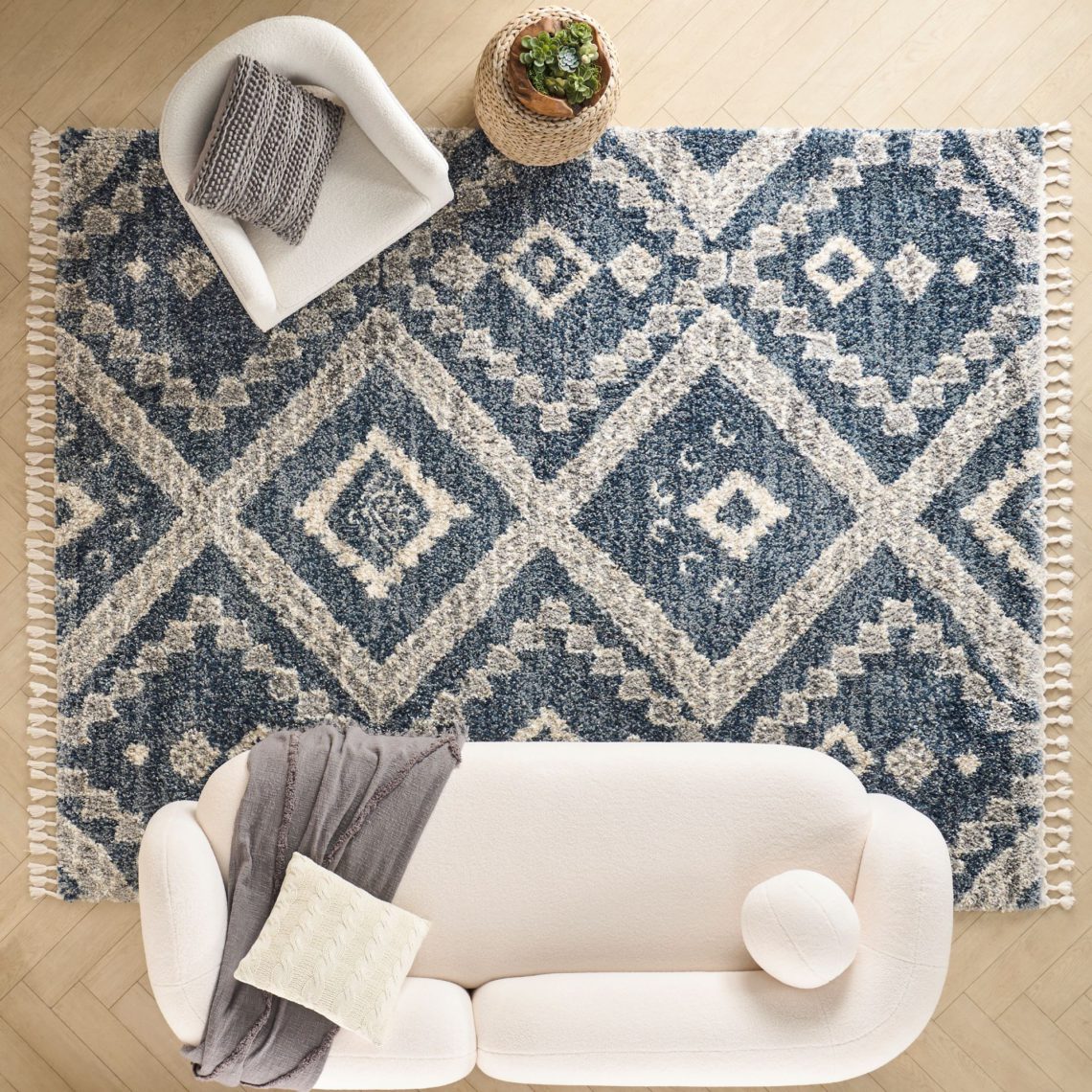 overhead view of a blue geometric shag rug in living room